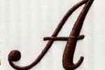 Example of a flowing, elegant script font for the initial 'A' in embroidery.